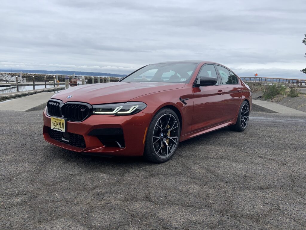 Front quarter view of a 2021 BMW M5 Competition in Motegi Red