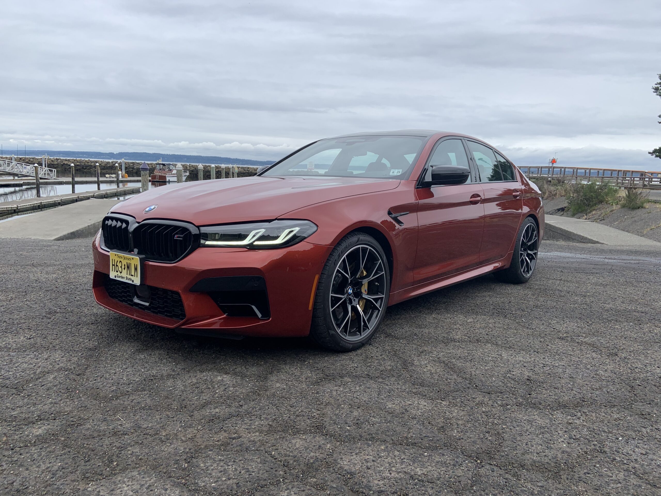 Front quarter view of a 2021 BMW M5 Competition in Motegi Red